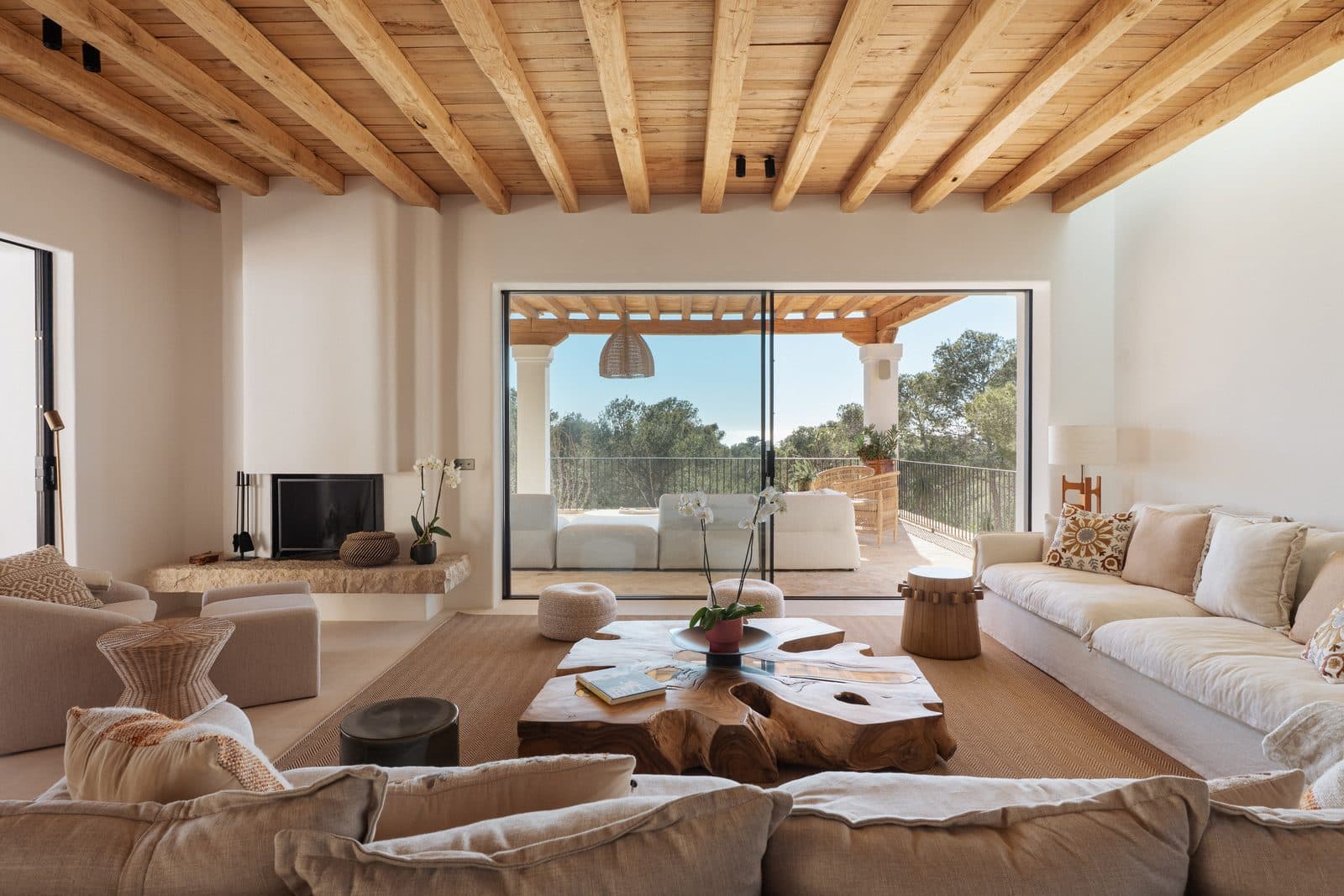 Bright open-plan villa living room with sea view